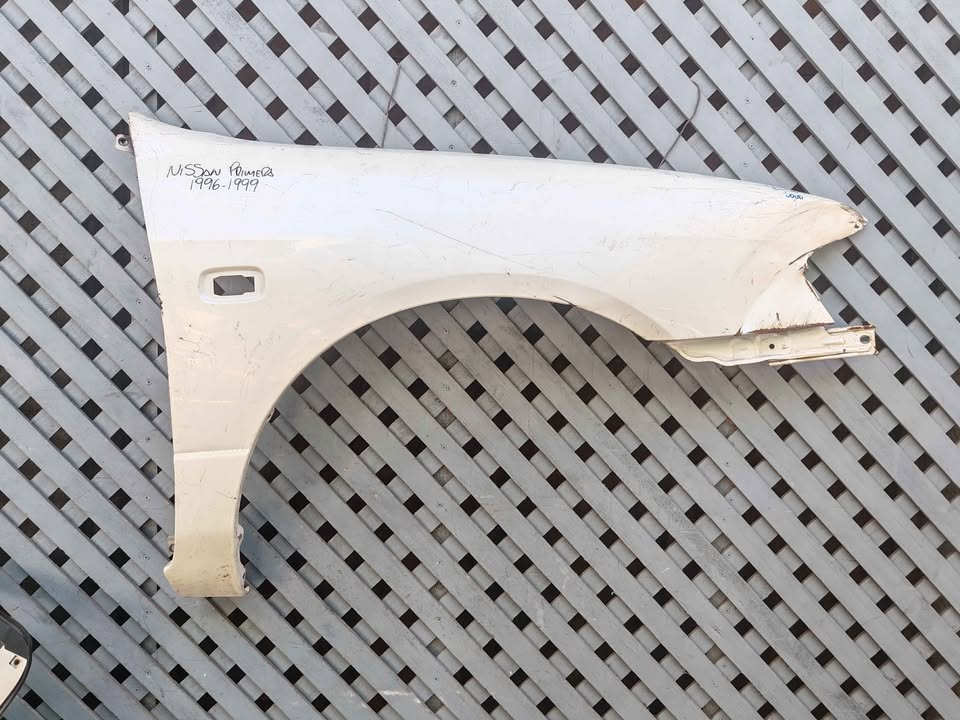 Tapabarro derecho Nissan Primera 1996 - 1999